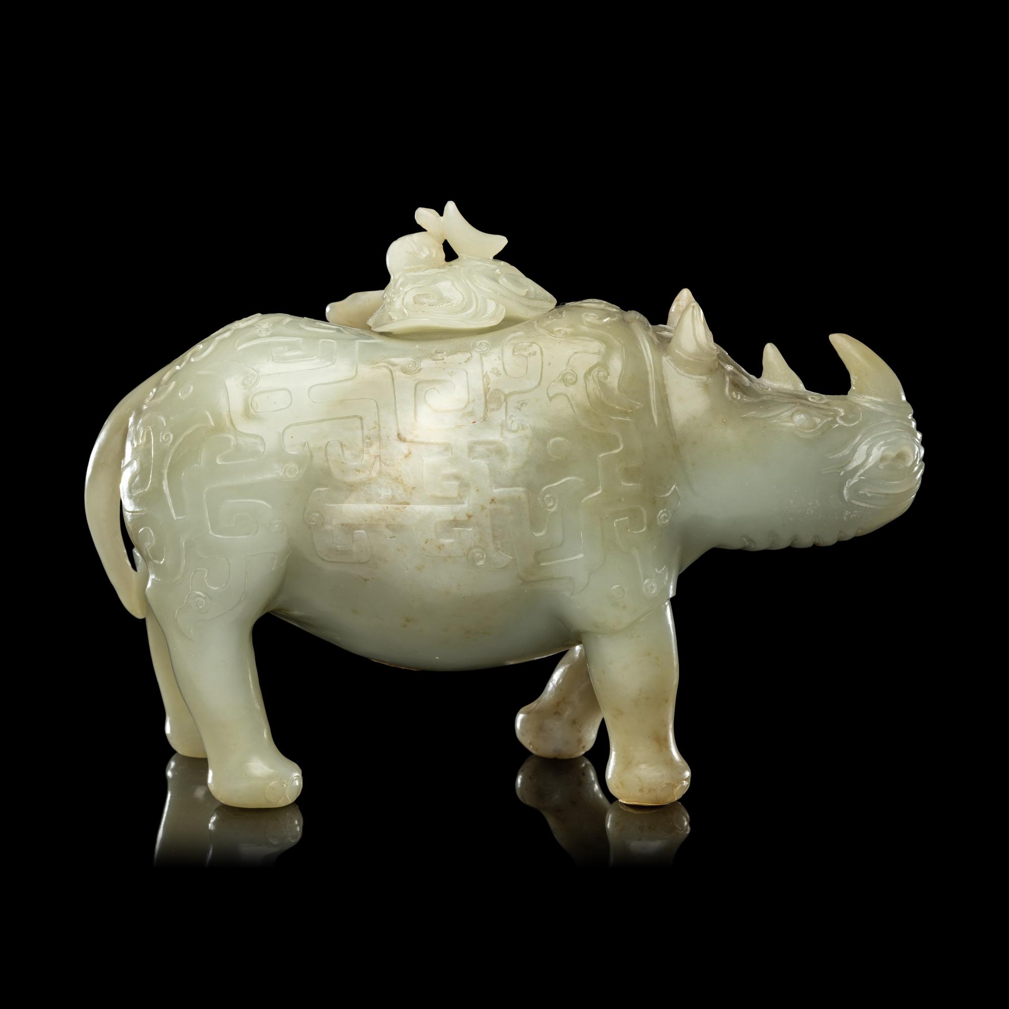 A Chinese Carved Celadon Jade Archaistic Rhinoceros-Form Covered Vessel, 20th Century 近代 青玉仿古犀尊