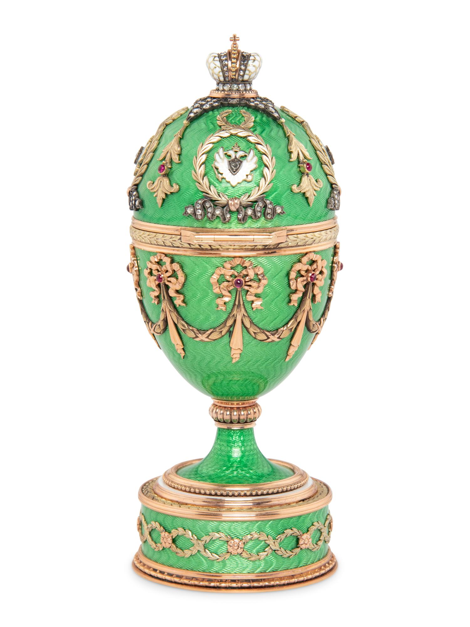 A Gold, Guilloché Enamel and Gemstone-Mounted Surprise Egg