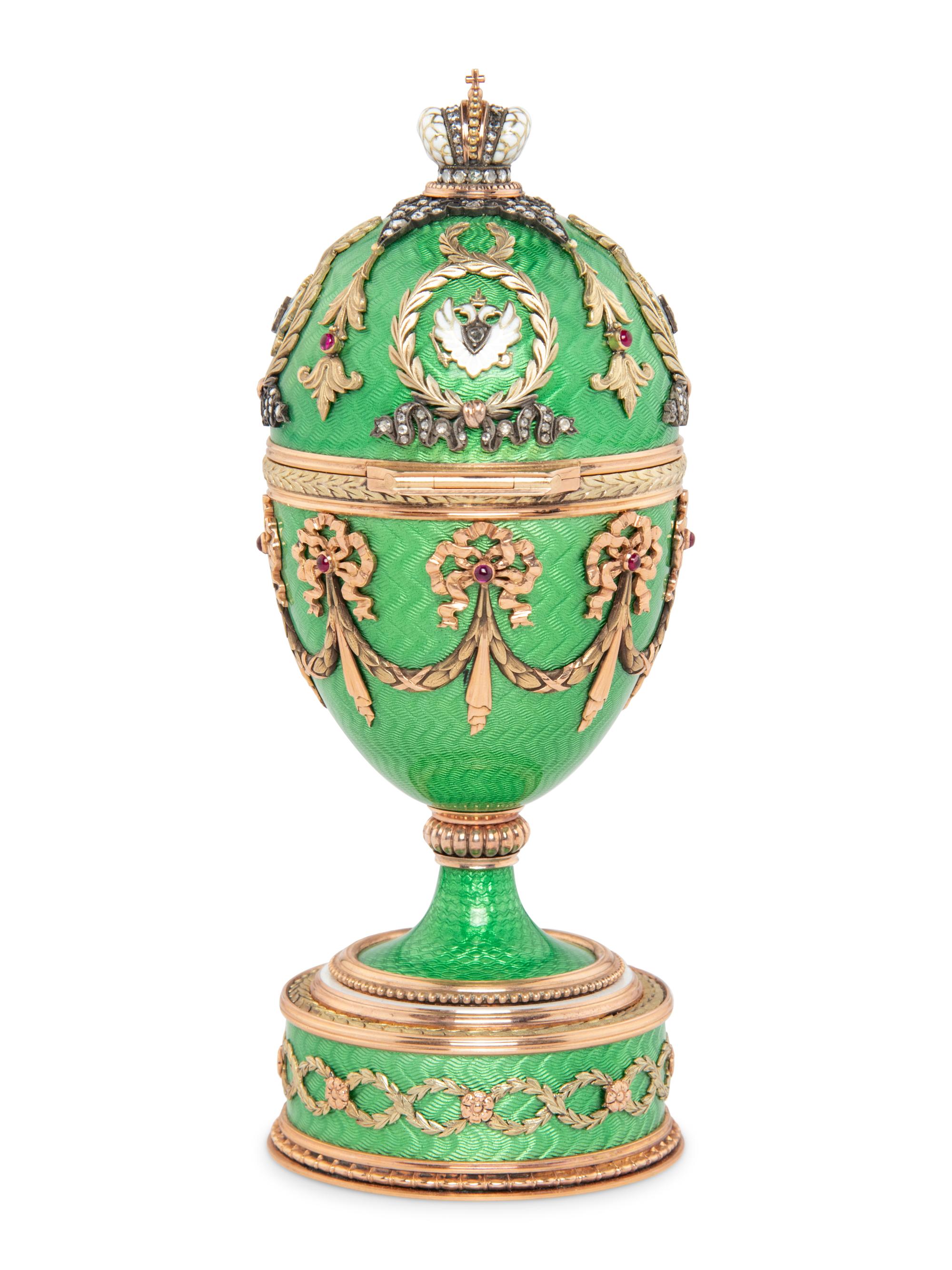 A Gold, Guilloché Enamel and Gemstone-Mounted Surprise Egg