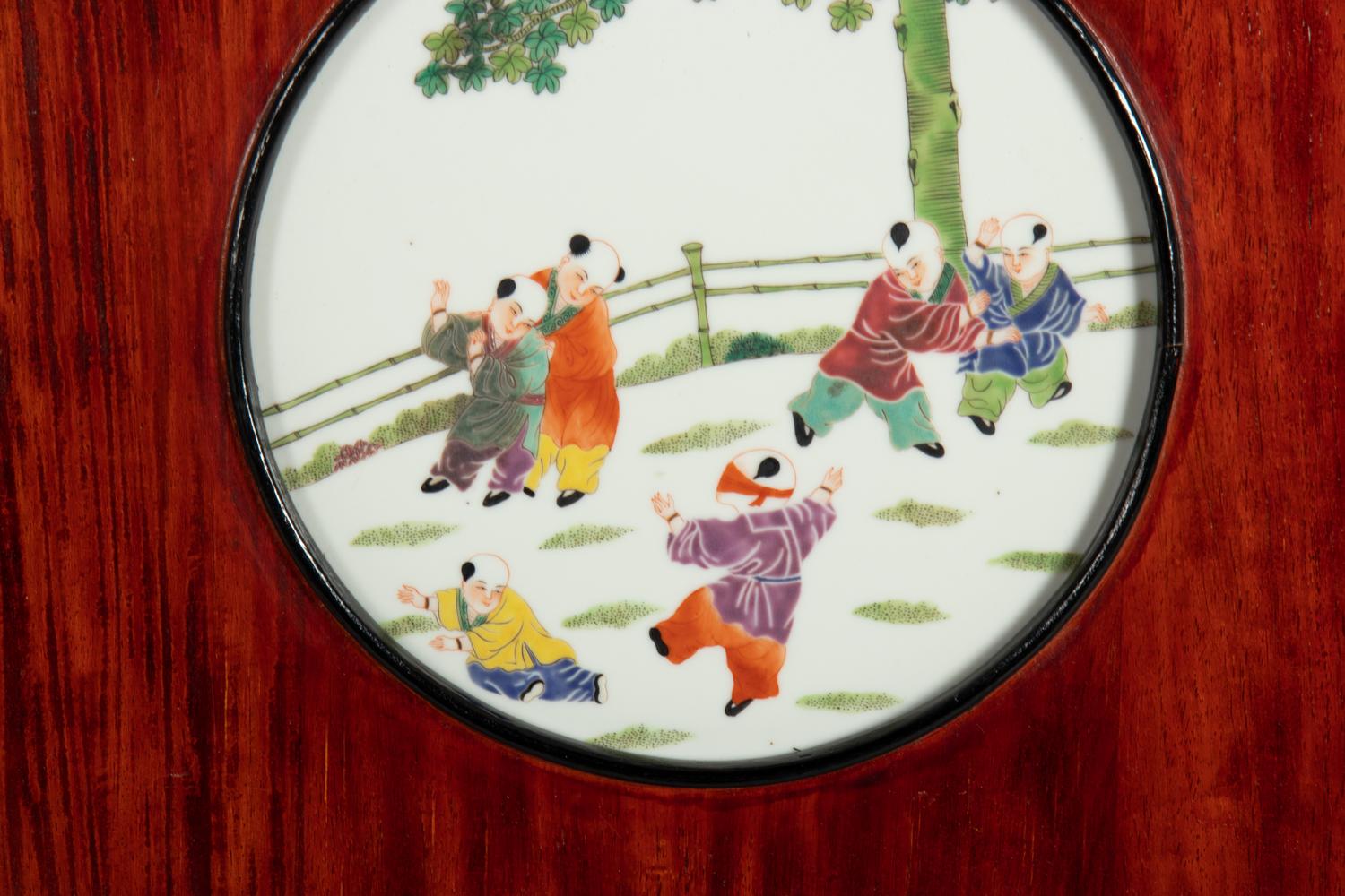 A Set of Four Chinese Famille Rose Porcelain Inset Hardwood Wall Panels