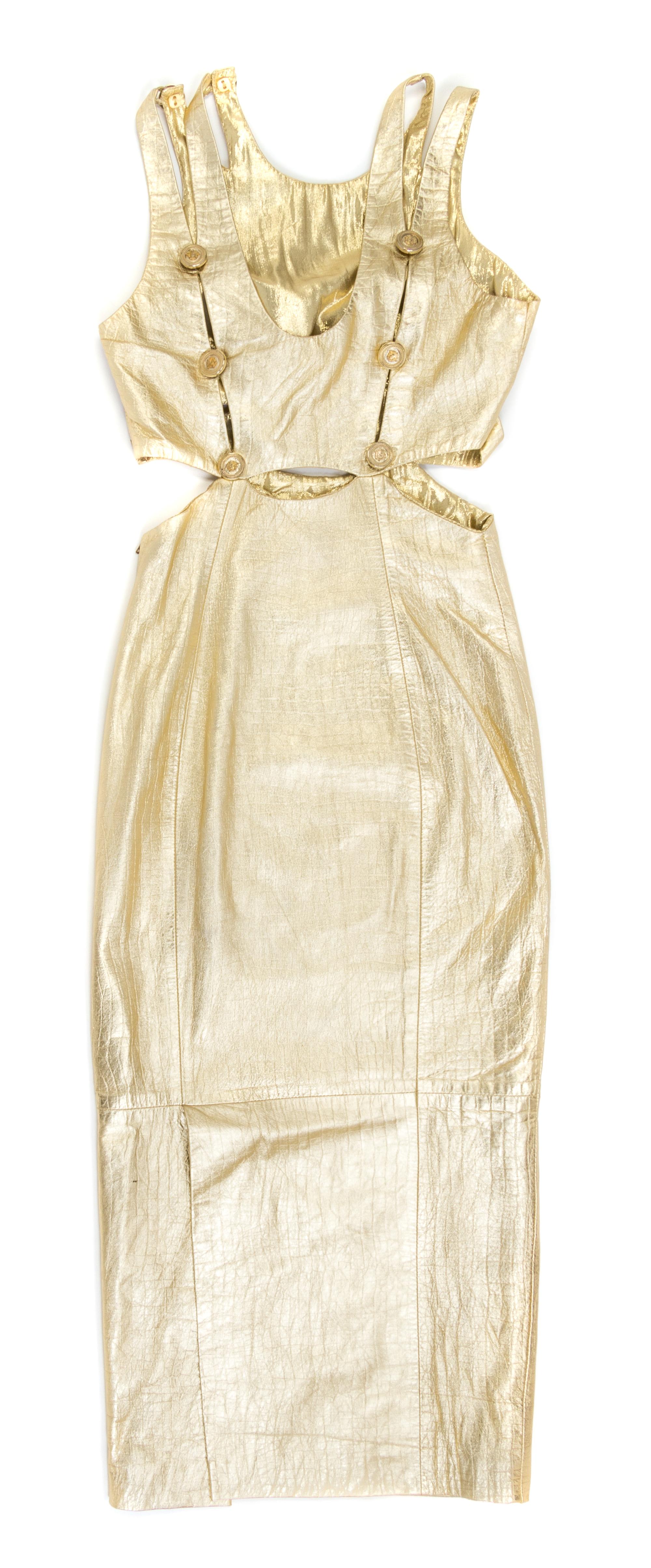 A Gianni Versace Gold Leather Cut Out Gown,