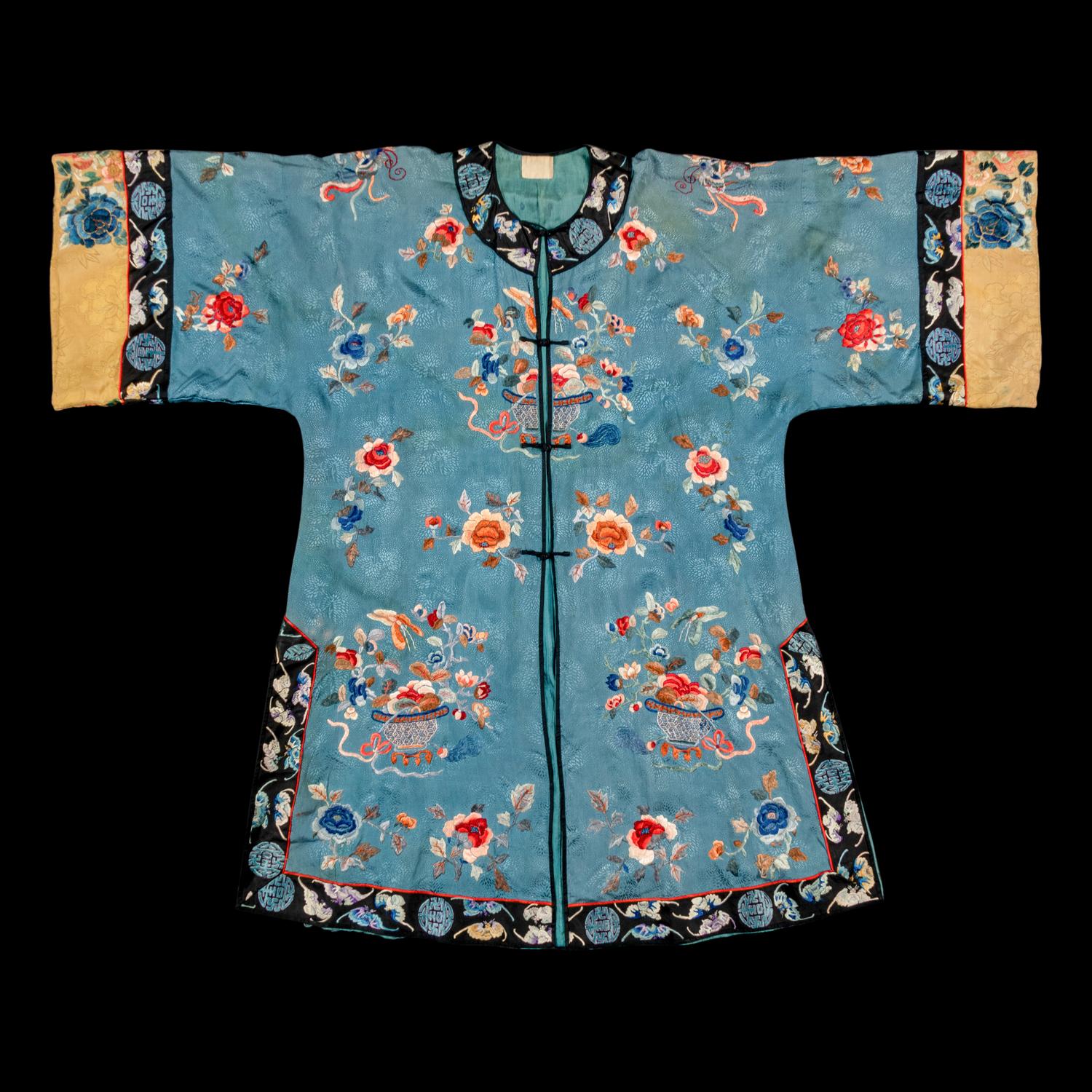 A Chinese Celeste Blue Ground Embroidered Silk Lady's Jacket 清晚期 藍地牡丹花籃紋褂