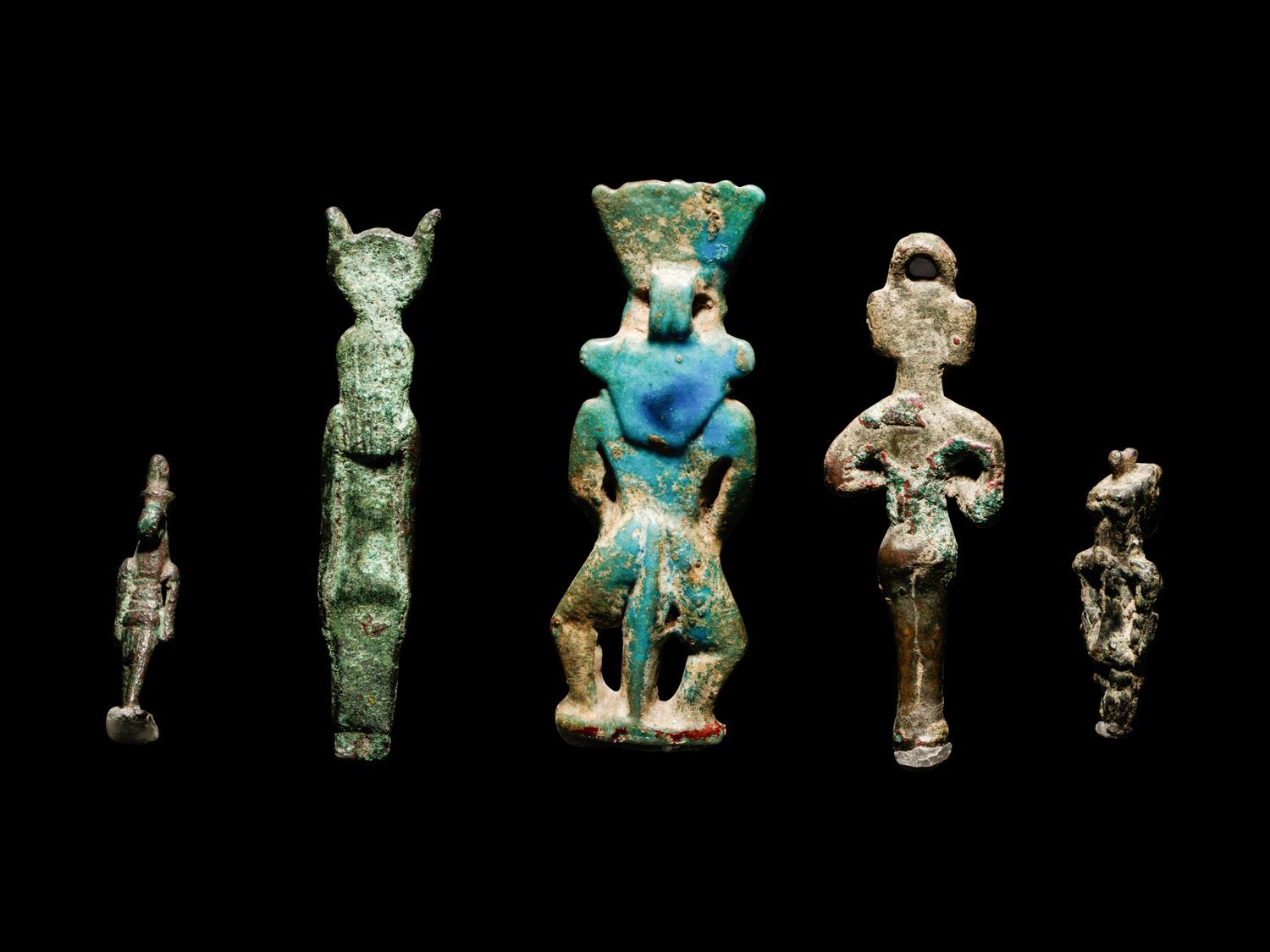 Four Egyptian Bronze Figures and One Egyptian Faience Bes