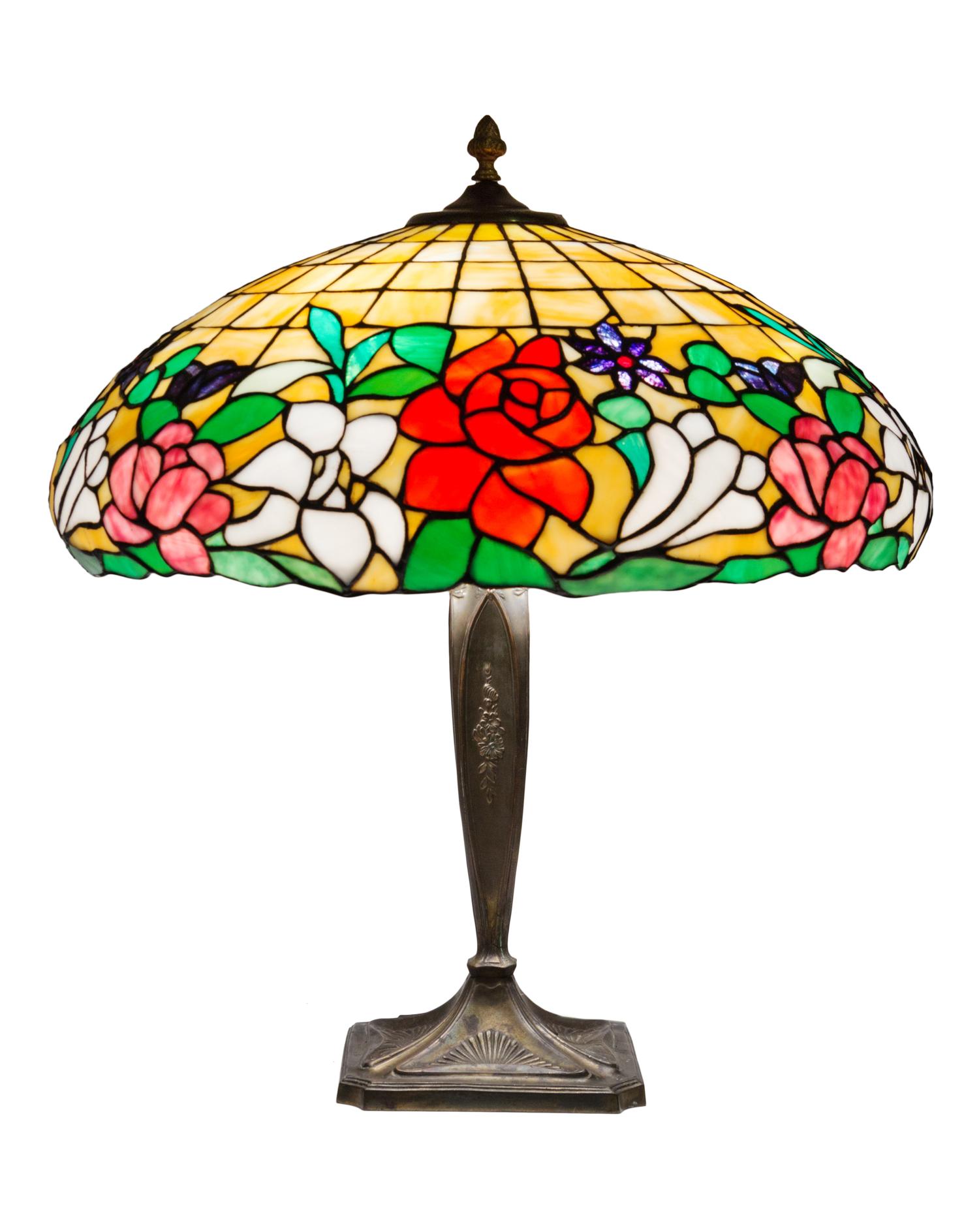 An American Leaded Glass Table Lamp Diameter of shade 19 inches, height overall 21 1/2 inches.