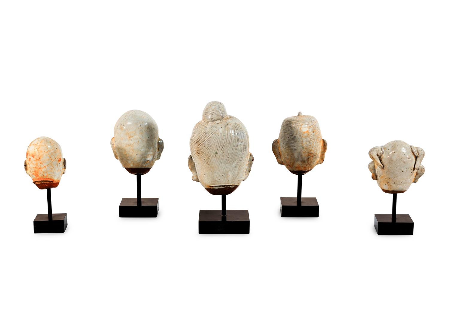 Five Glazed Earthenware Deity Heads