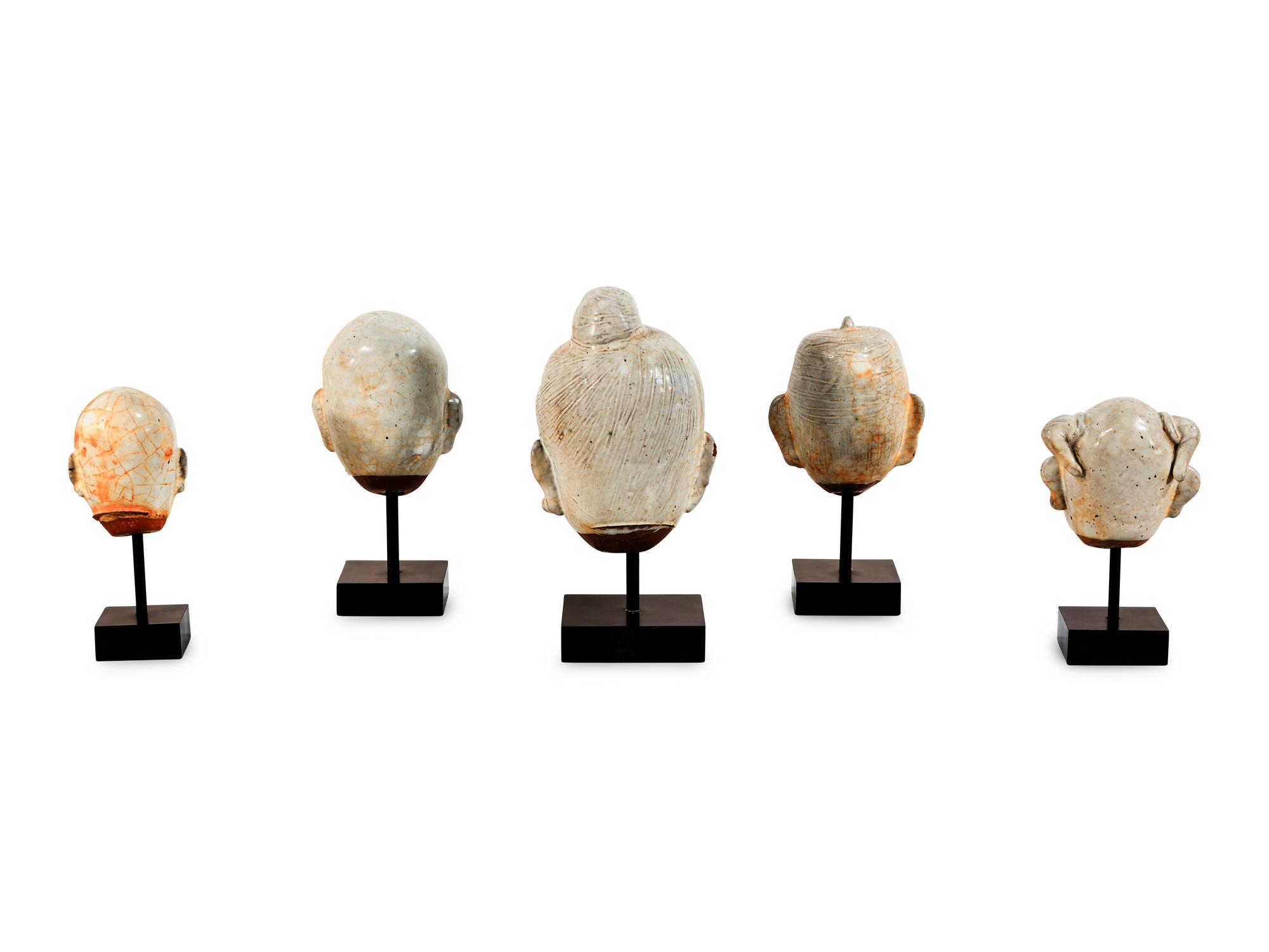 Five Glazed Earthenware Deity Heads