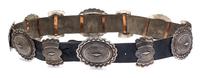 A Sterling Silver, Copper and Leather Concho Belt, Navajo, 379.20 dwts. (including leather)