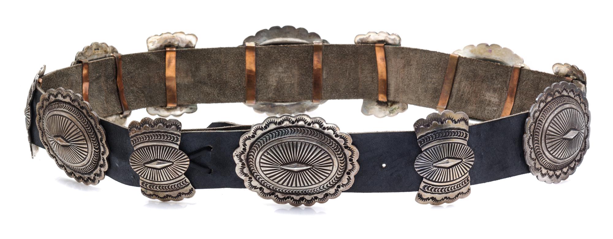 A Sterling Silver, Copper and Leather Concho Belt, Navajo, 379.20 dwts. (including leather)