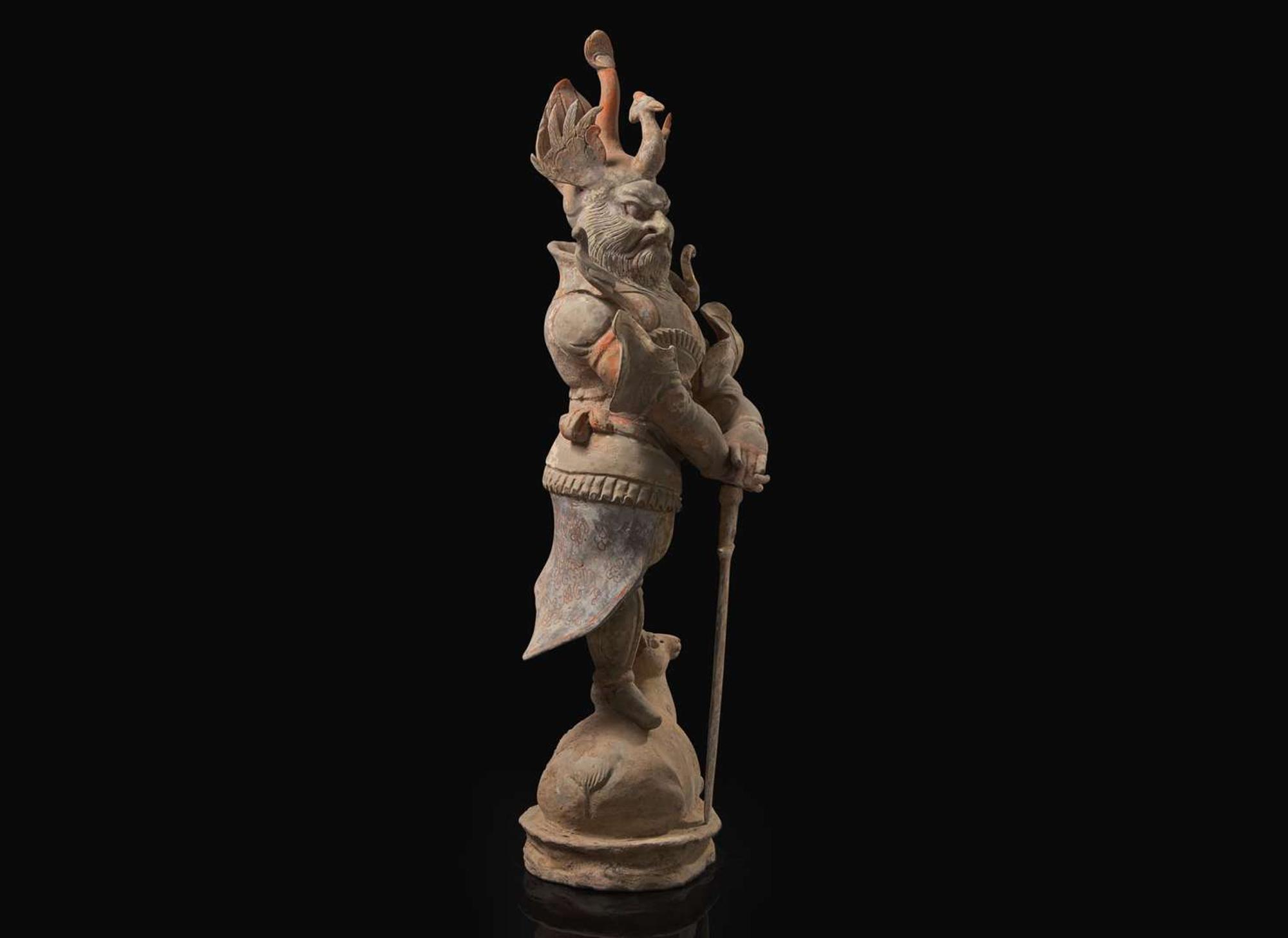 A Chinese painted and parcel-gilt pottery guardian, Tang dynasty 彩繪漆金陶俑天王 唐