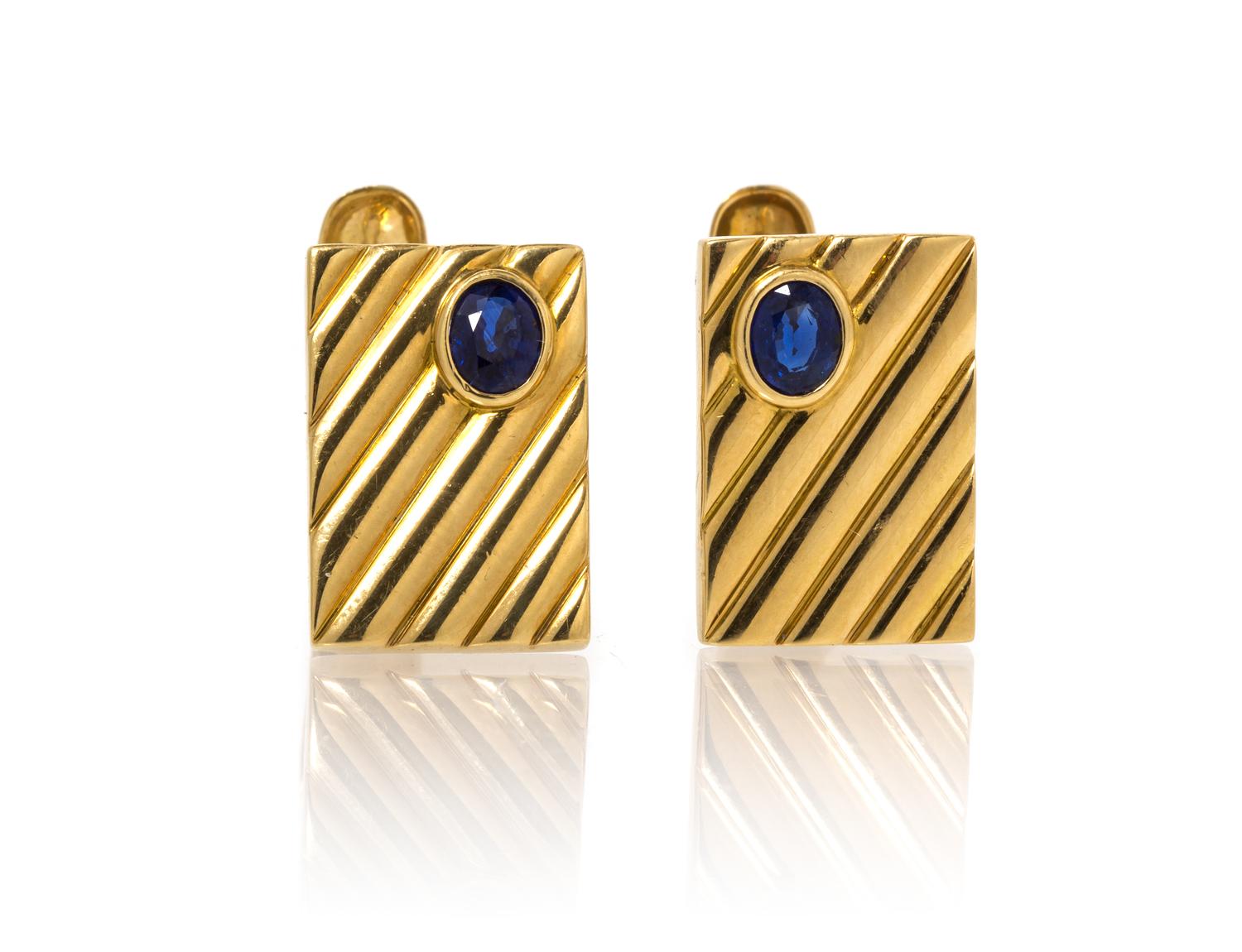 A Pair of 18 Karat Yellow Gold and Sapphire Cufflinks. 8.90 dwts.