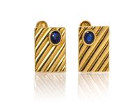 A Pair of 18 Karat Yellow Gold and Sapphire Cufflinks. 8.90 dwts.