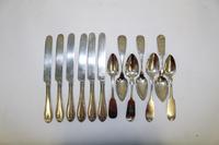 A Group of Six American Coin Silver Flatware Articles, Various Makers, comprising 6 dinner knives and 7 fiddle-form teaspoons.