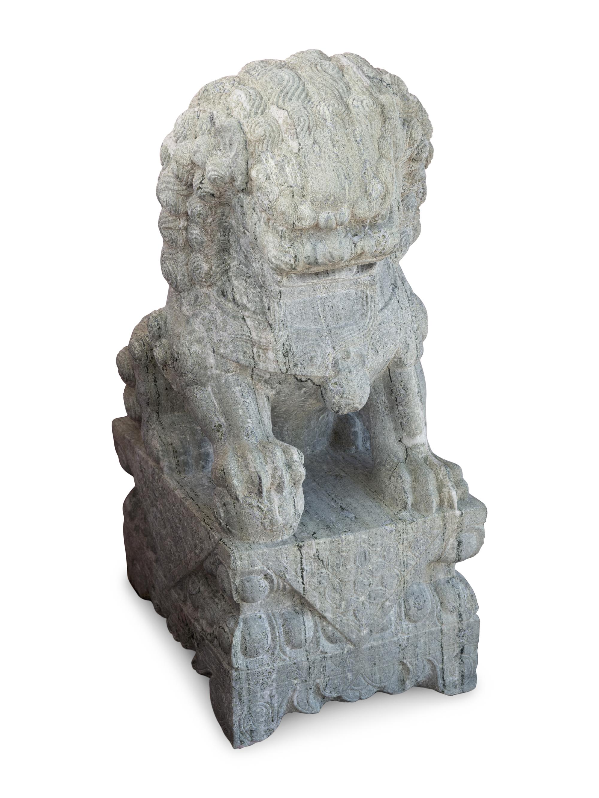 A Pair of Large Chinese Carved Green Marble Fu-Lions