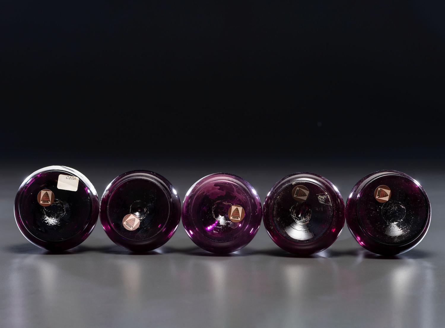 Five 'Mary Gregory' Amethyst Glass Barber Bottles