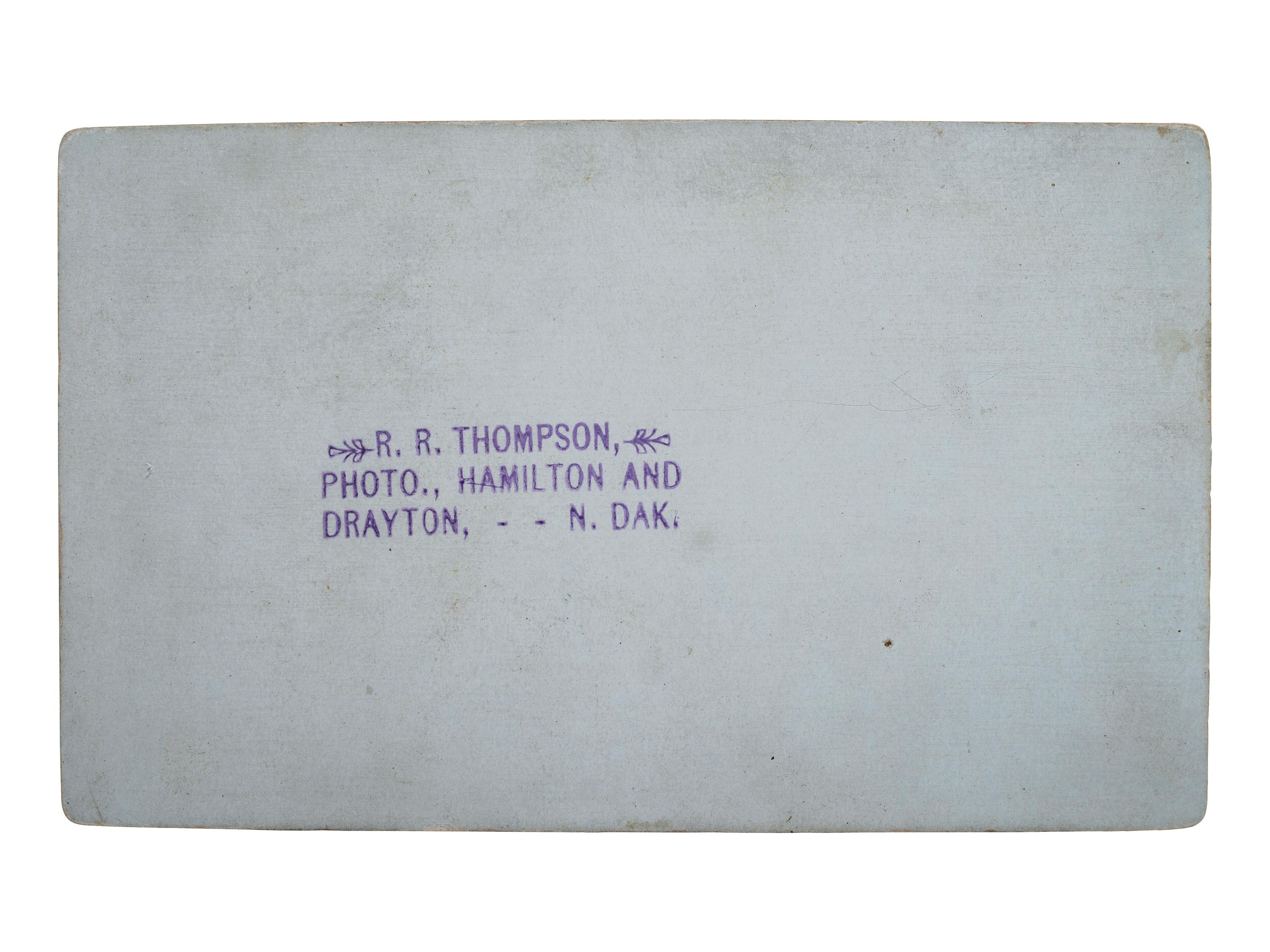[EARLY PHOTOGRAPHY]. THOMPSON, R.R., photographer. Postmortem CDV of an infant. Drayton, ND.
