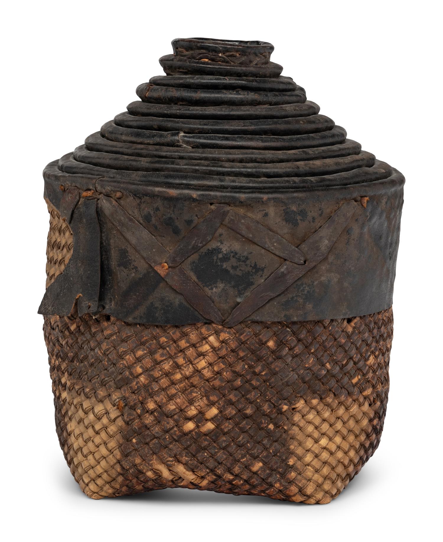 A Set of Eleven Woven and Leather Nesting Baskets