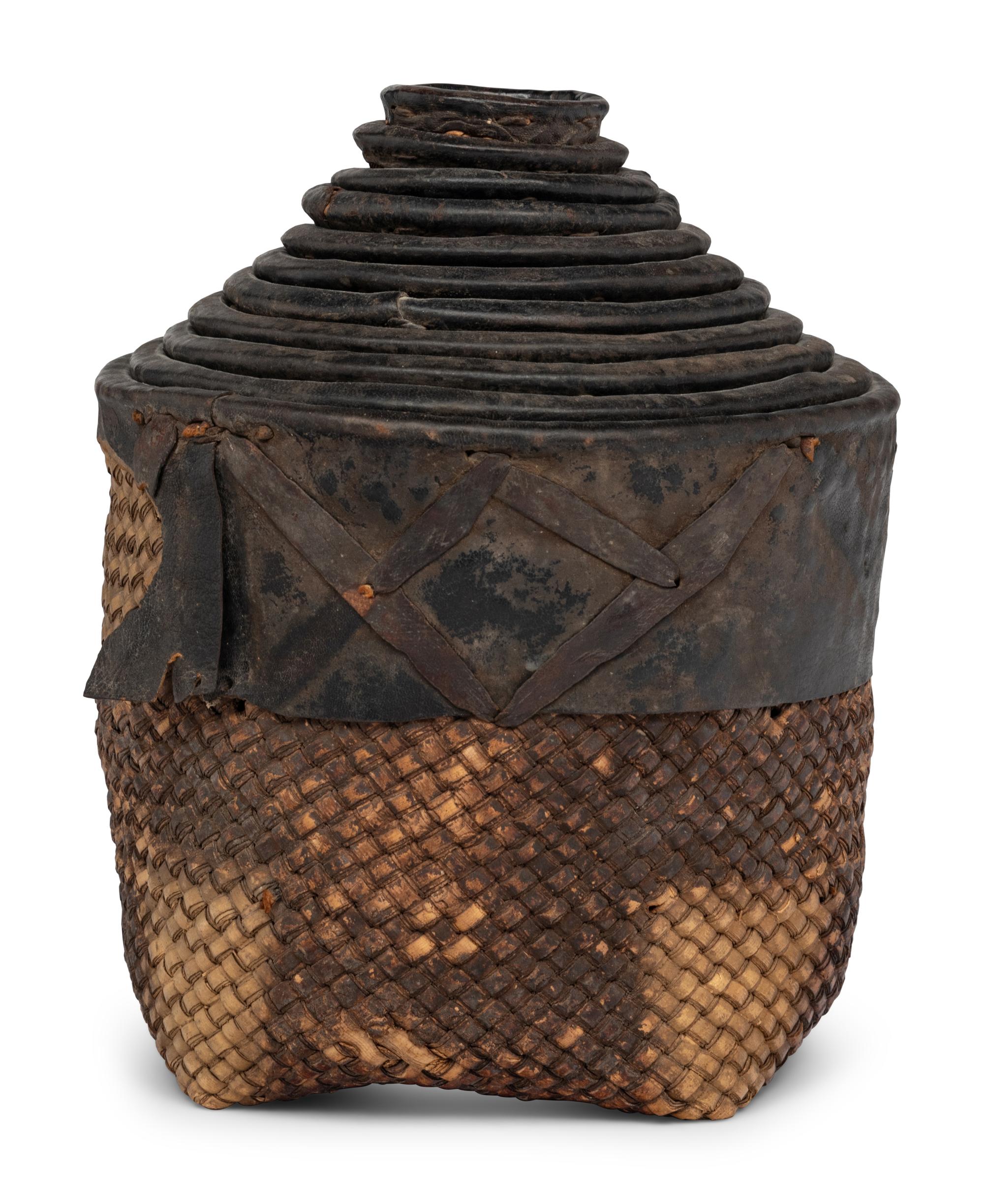 A Set of Eleven Woven and Leather Nesting Baskets