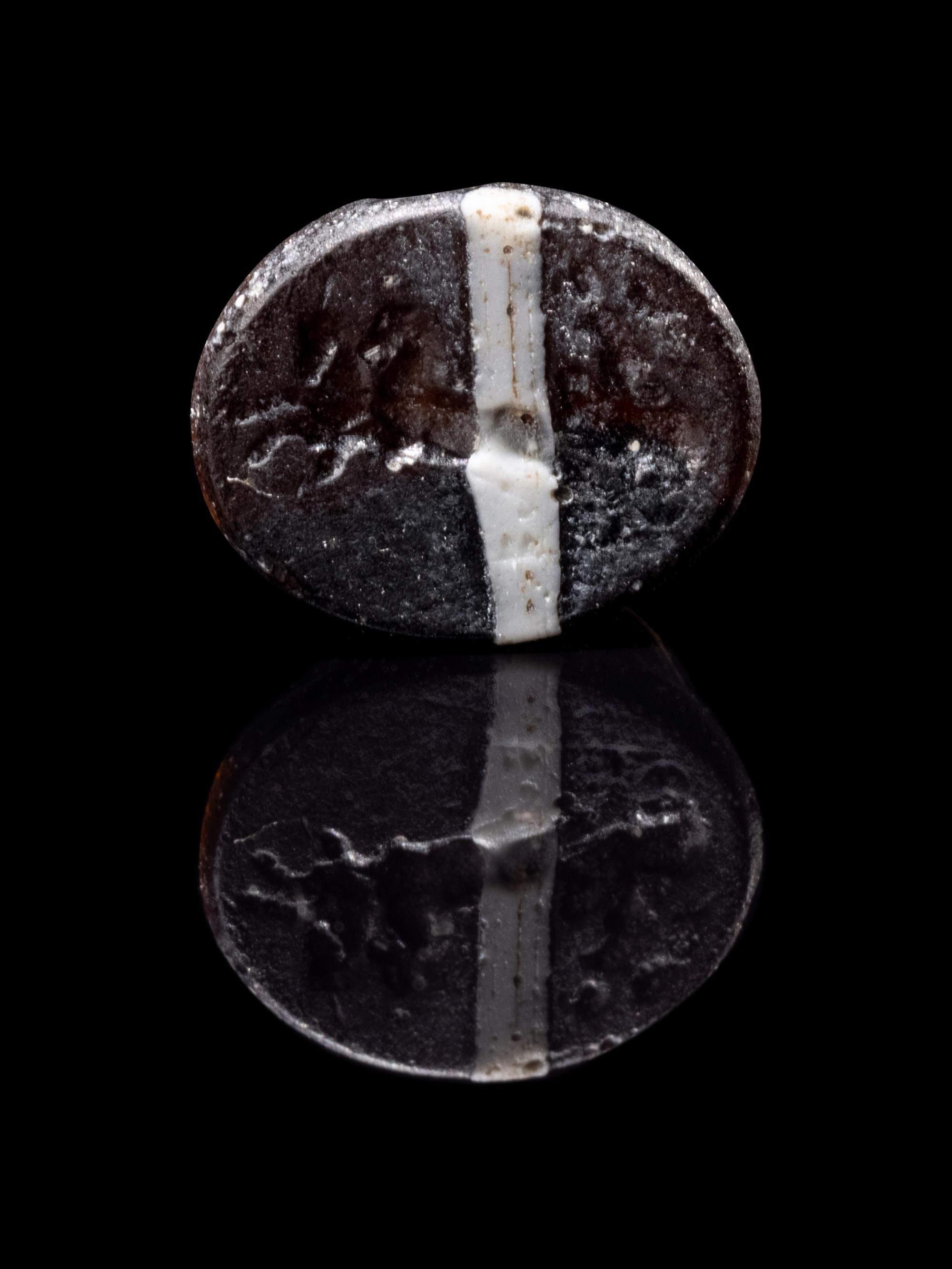 A Roman Steatite Ring Stone with Victory Riding a Chariot