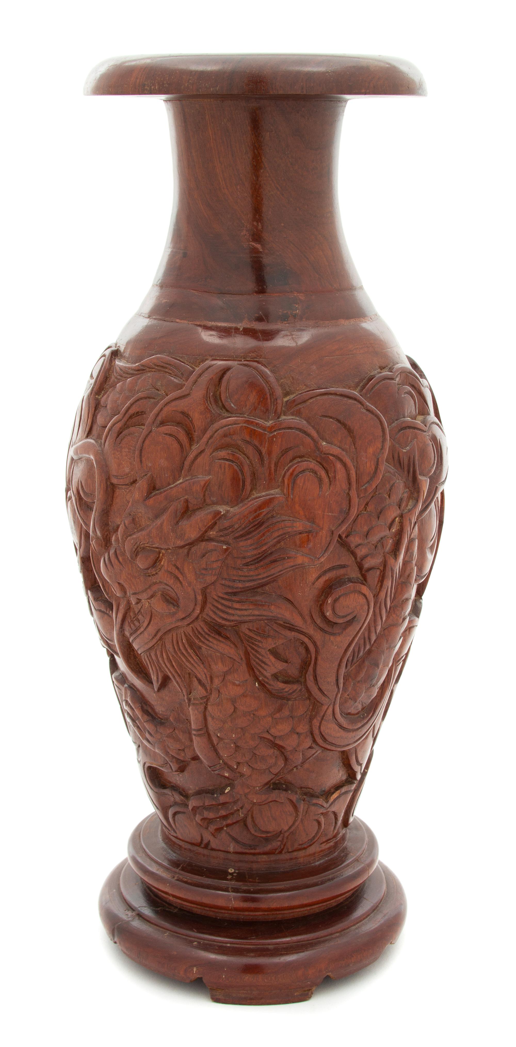 An Asian Carved Hardwood Baluster-form Vase Height 15 3/4 inches — 20TH CENTURY