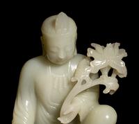 A Pale Celadon Jade Figure of Guanyin