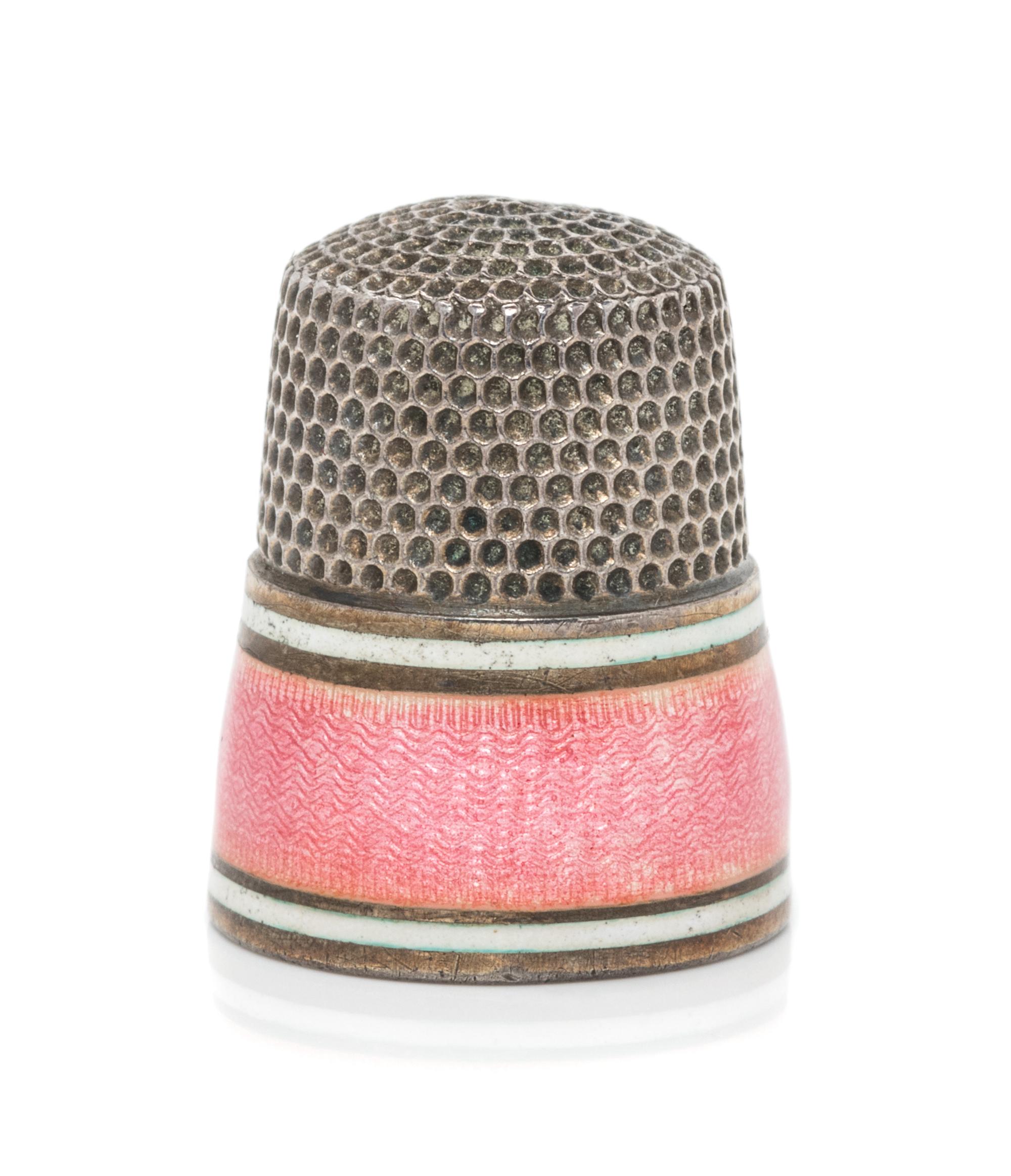 An American Silver and Guilloche Enamel Thimble, Simons Bros., Philadelphia, PA, the knurled top and body above two white enamel bands