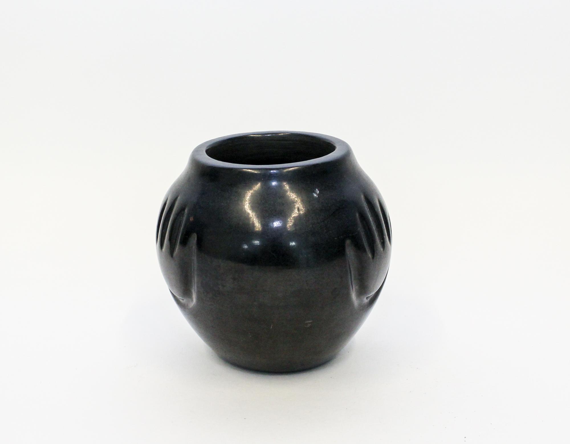 A Santa Clara Blackware Miniature Vase. Height 4 3/4 inches.