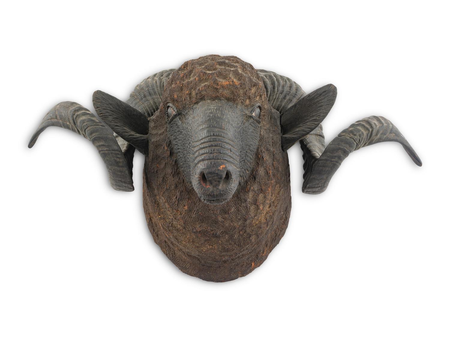 A Carved Walnut Ram's Head