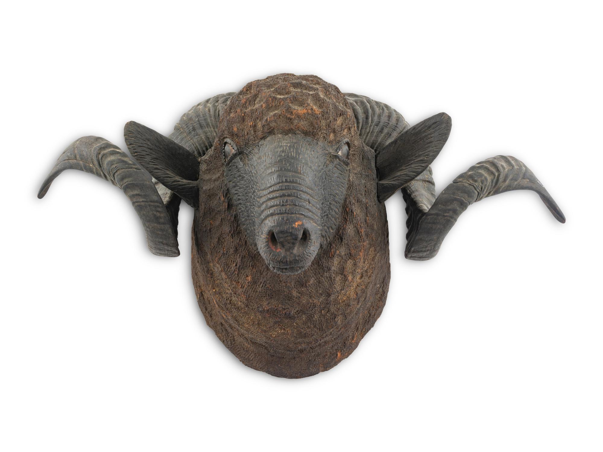 A Carved Walnut Ram's Head