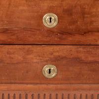 A French Directoire carved fruitwood commode with white marble top circa 1800