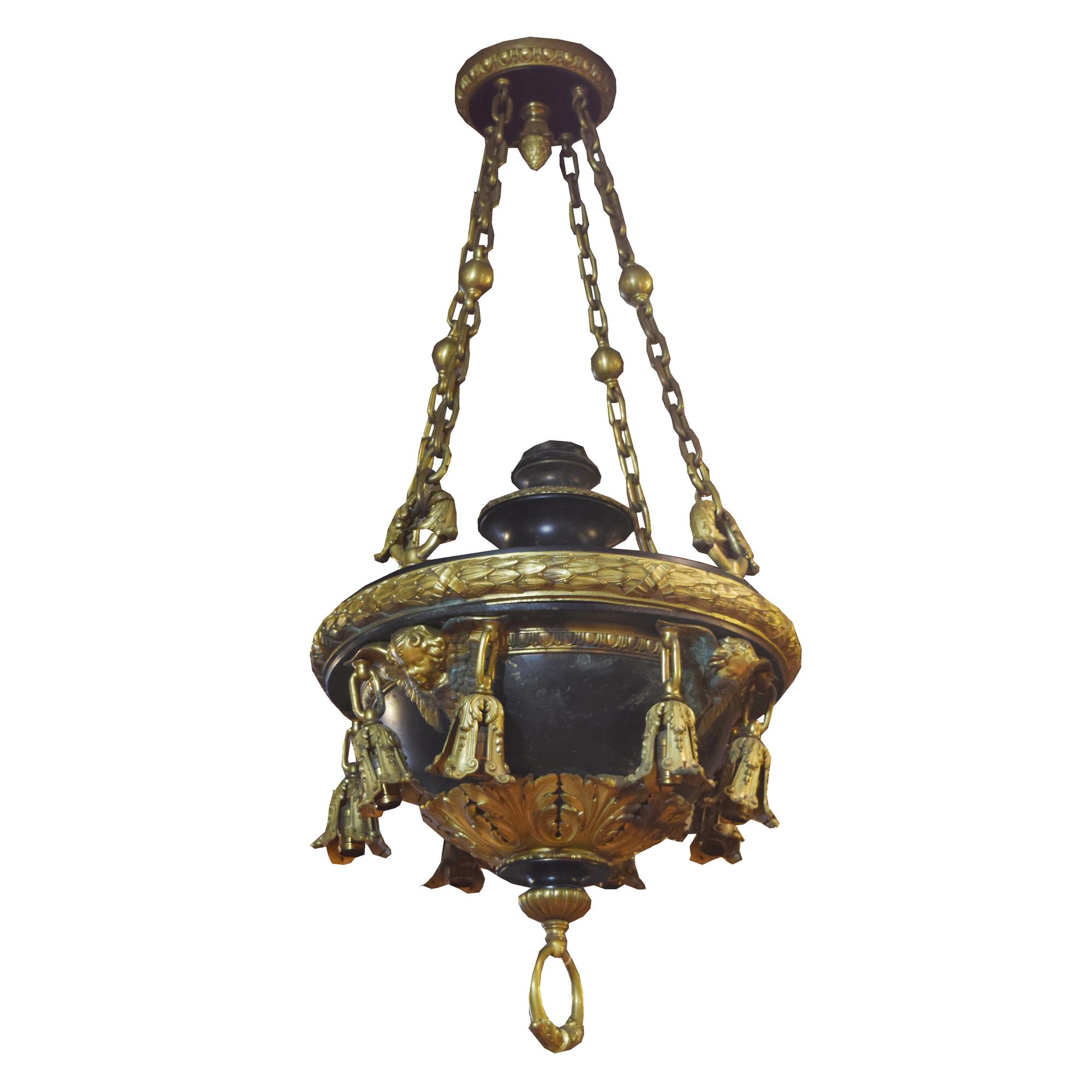 A Pair of Bronze Chandeliers with Cherub Masks 24" W x 24" D x 58" H — United States, Circa 1900
