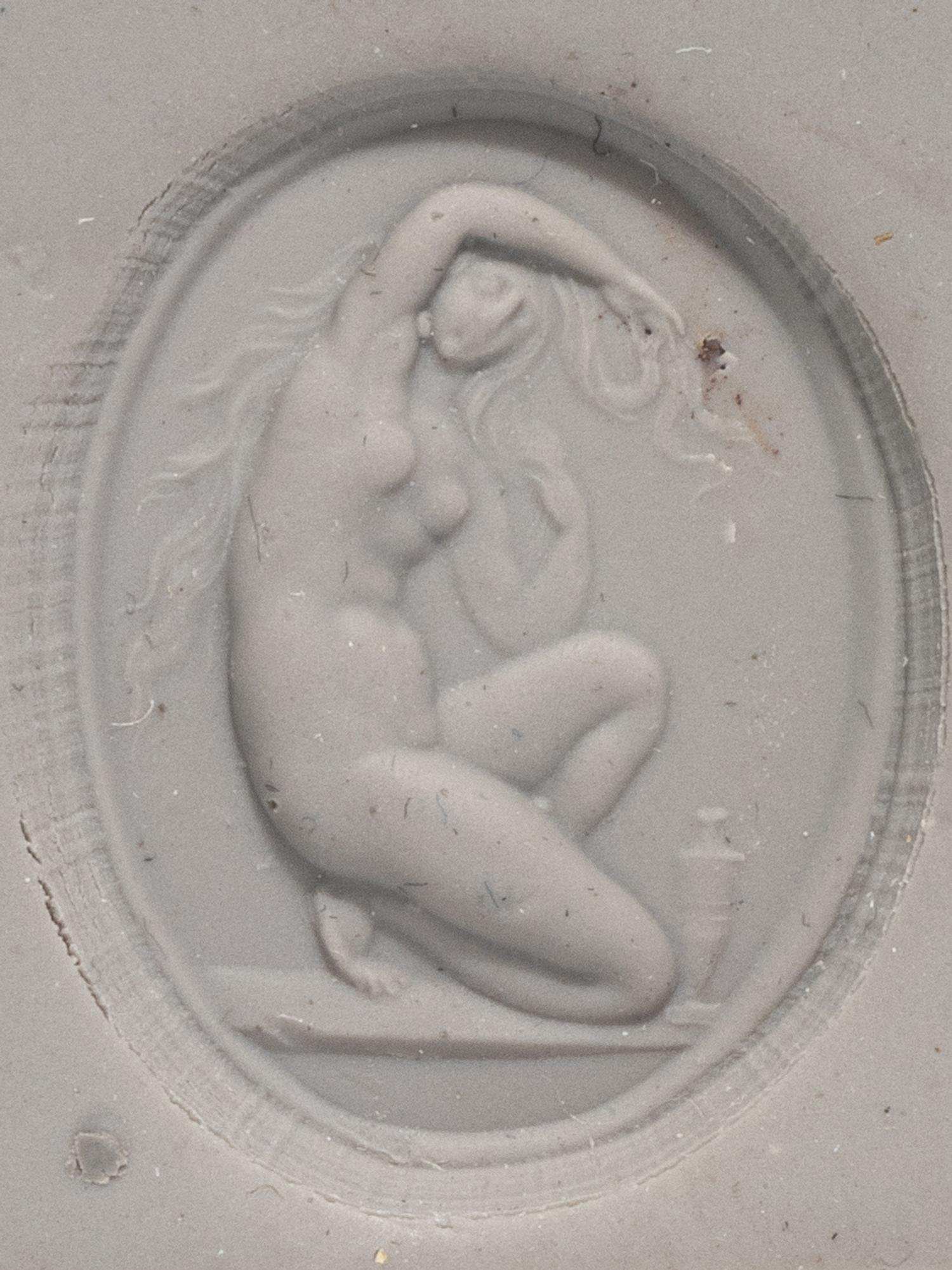 A Neoclassical Glass Intaglio with the Goddess Venus and a Carnelian Ring Stone