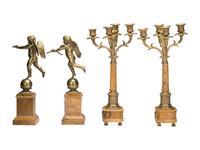 A Pair of Brass and Marble Cherub Bookends and Four-Light Candelabra