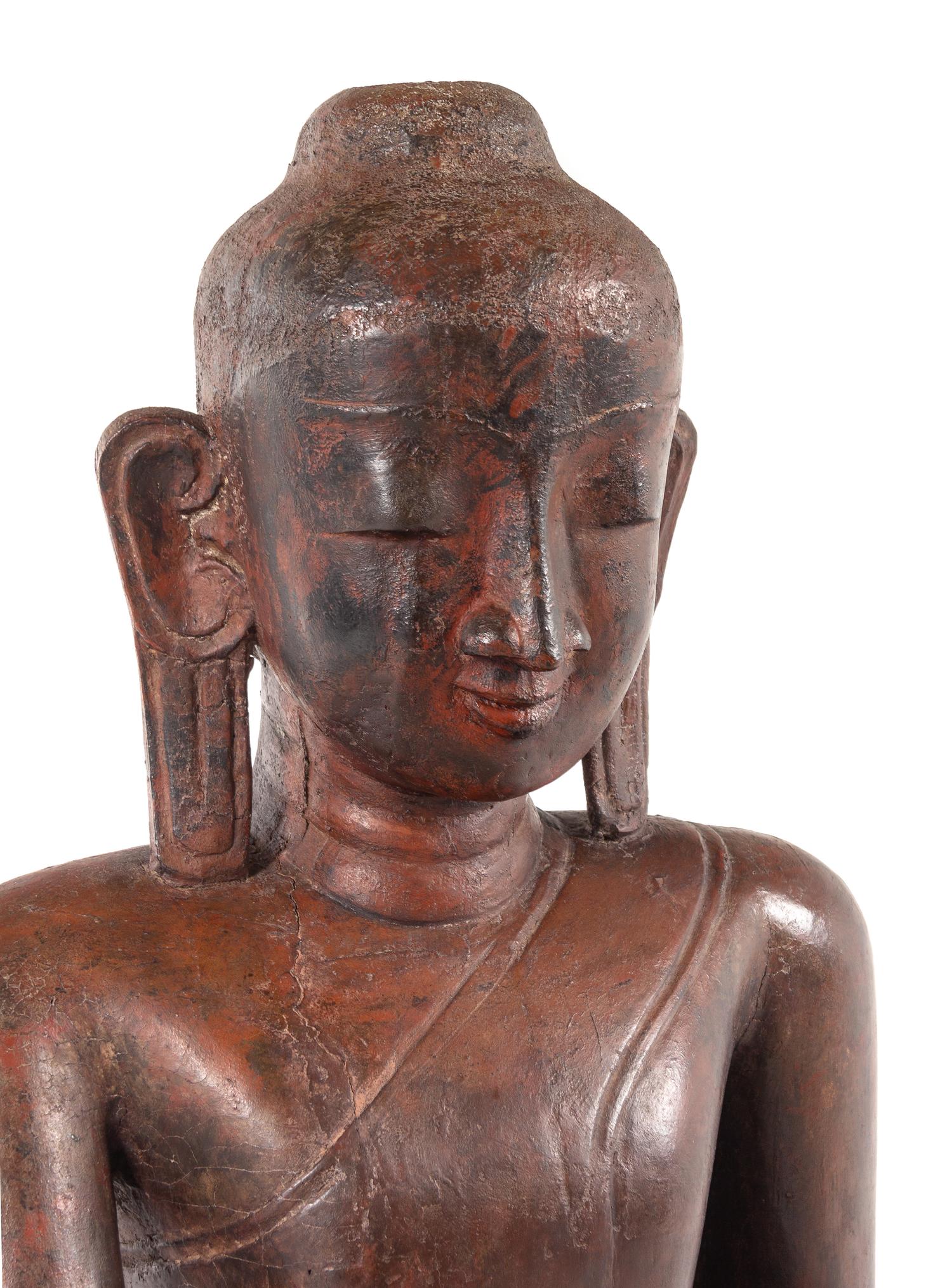 A Burmese Carved Wood Figure of Seated Buddha