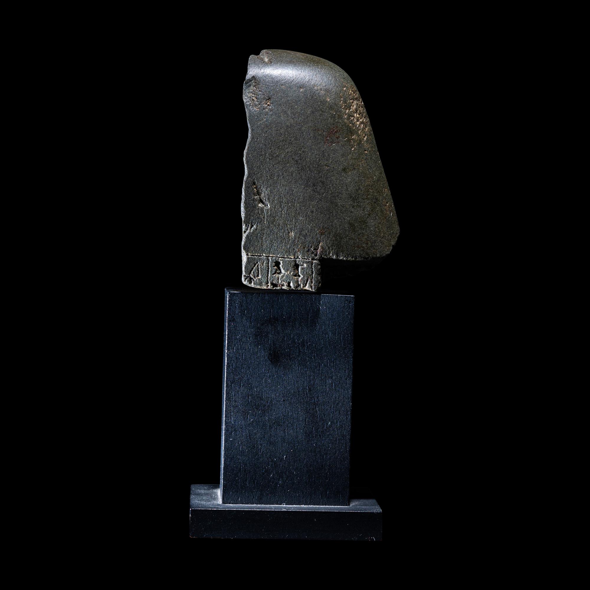 An Egyptian Schist Head of a Male