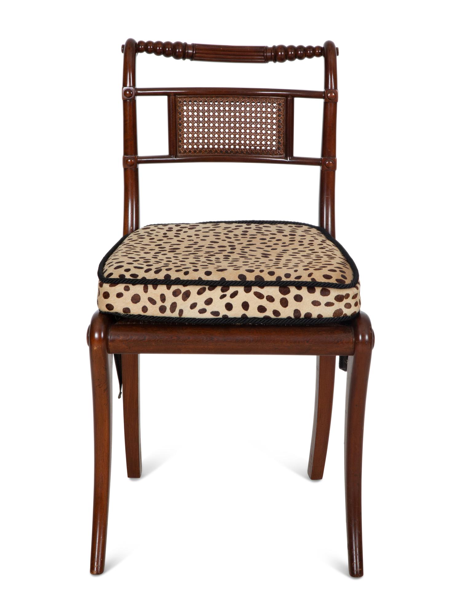 A Set of Four Regency Style Mahogany Cane Seat Dining Chairs