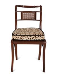 A Set of Four Regency Style Mahogany Cane Seat Dining Chairs