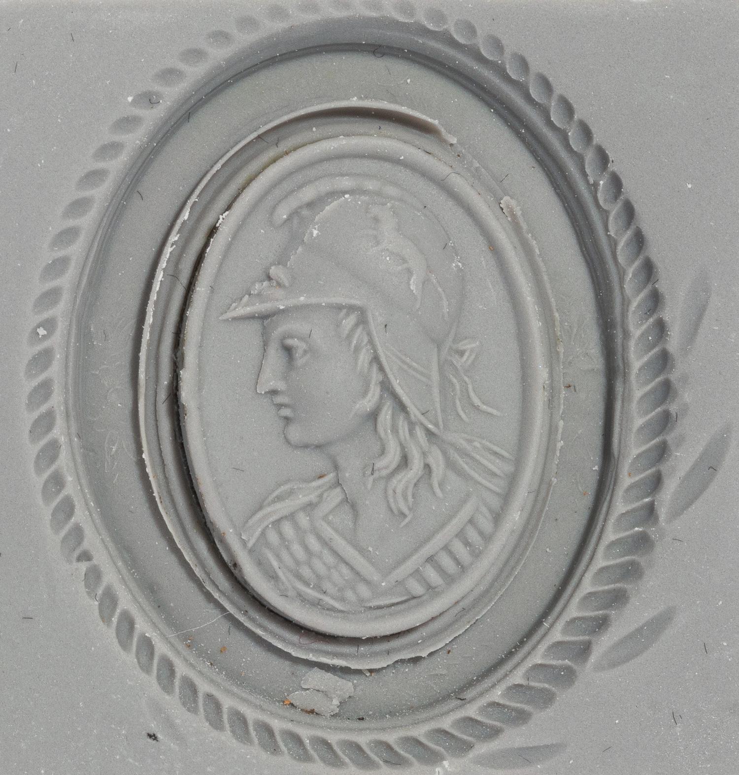 A Neoclassical Gold and Carnelian Brooch with a Bust of Athena