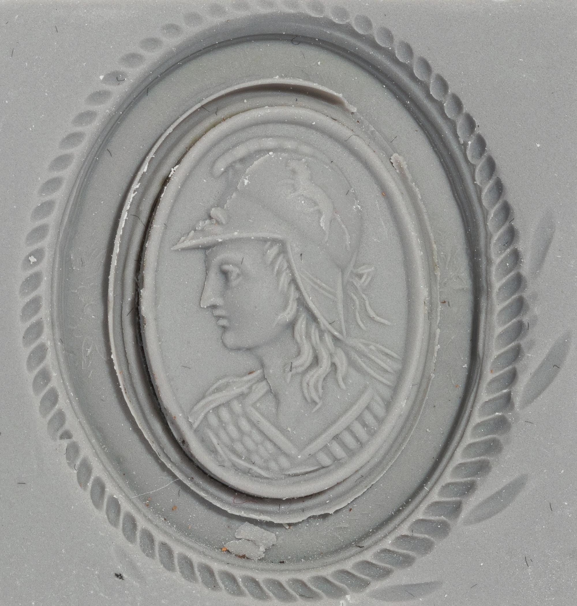 A Neoclassical Gold and Carnelian Brooch with a Bust of Athena