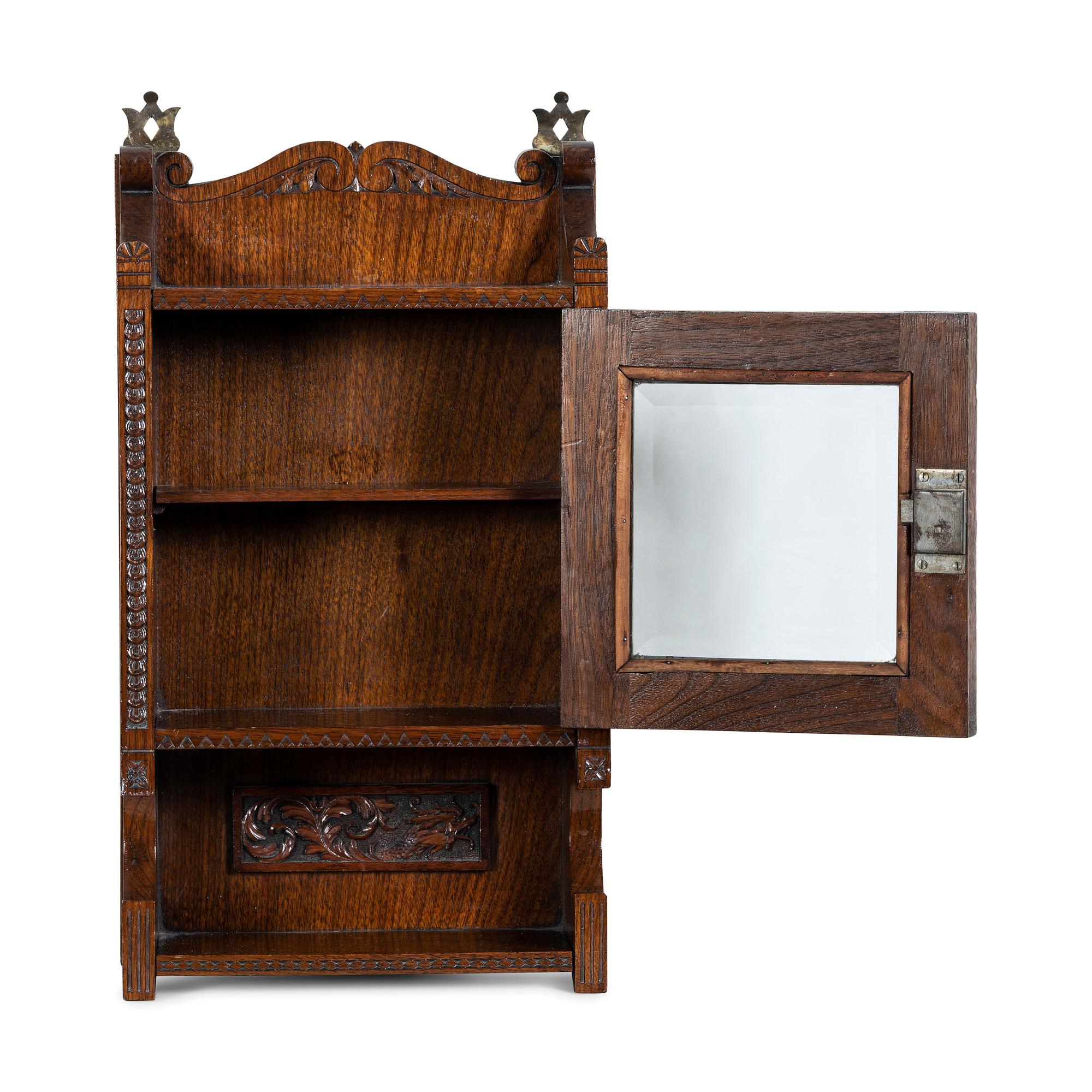A Cincinnati Art-Carved Wall Cabinet in Walnut
