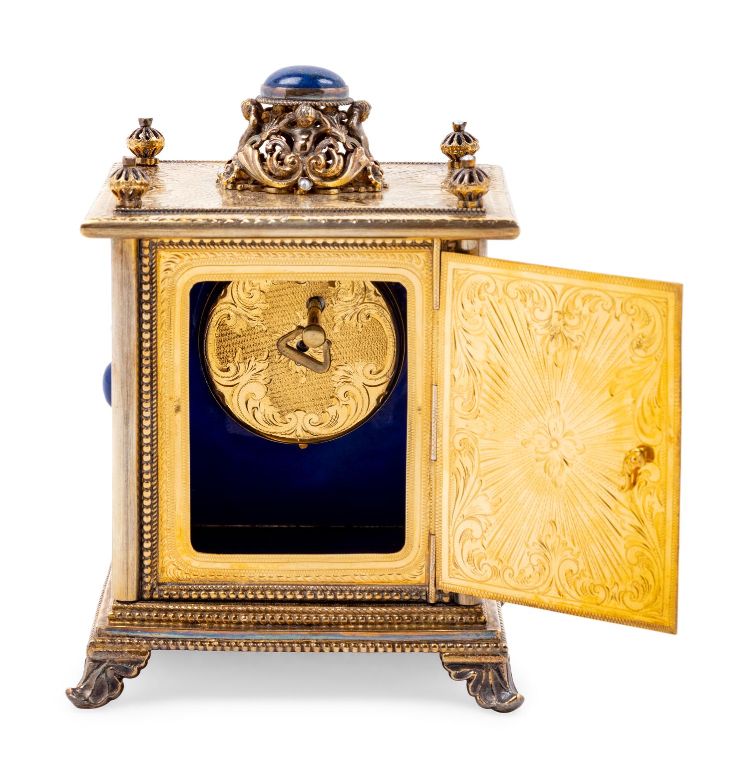 A Continental Blue Hardstone and Cultured Pearl Inset Gilt Metal and Enameled Table Clock