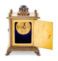 A Continental Blue Hardstone and Cultured Pearl Inset Gilt Metal and Enameled Table Clock