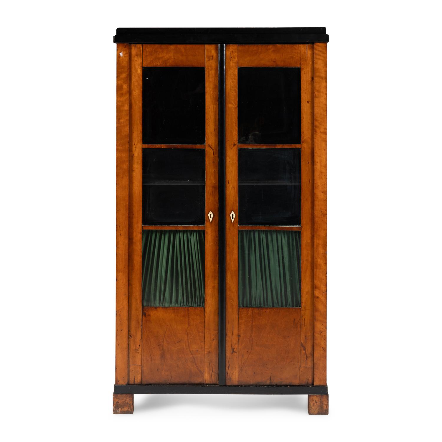 A Biedermeier Figured Maple and Part-Ebonized Bookcase