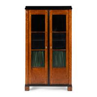 A Biedermeier Figured Maple and Part-Ebonized Bookcase