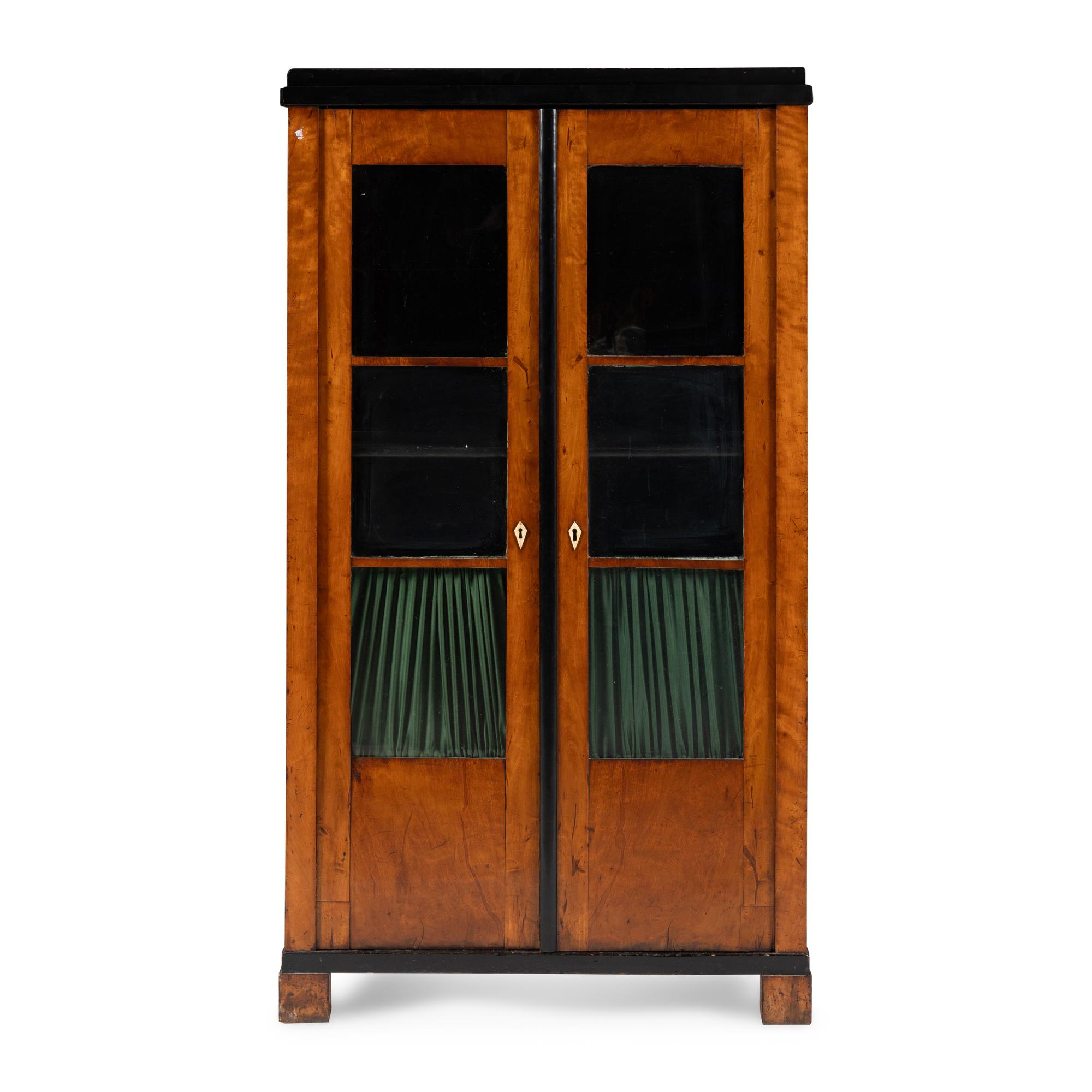 A Biedermeier Figured Maple and Part-Ebonized Bookcase