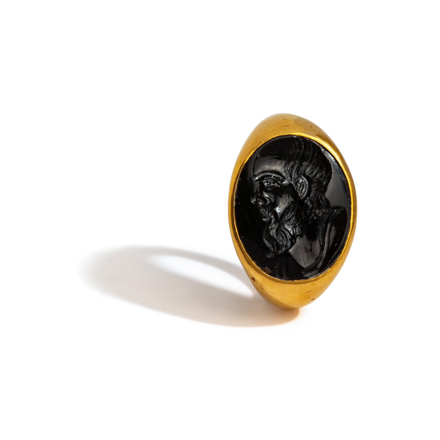 A Roman Black Jasper Intaglio with a Portrait Head of Socrates — Set in a gold ring