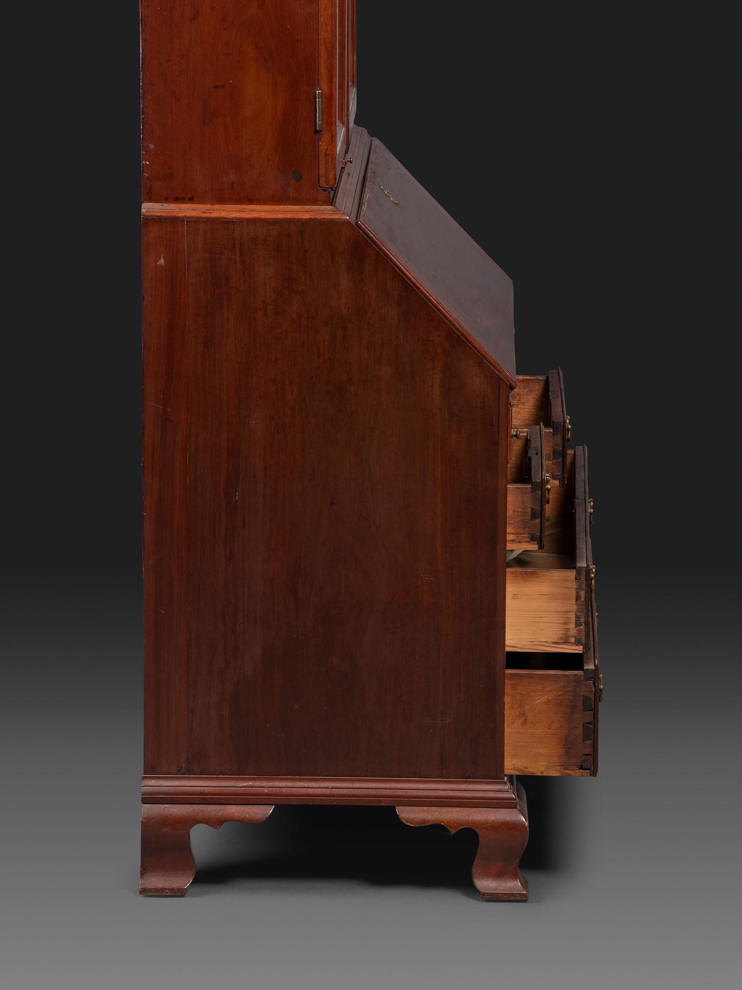 A Chippendale Figured Mahogany Bonnet Top Desk-and-Bookcase