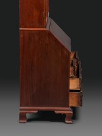 A Chippendale Figured Mahogany Bonnet Top Desk-and-Bookcase