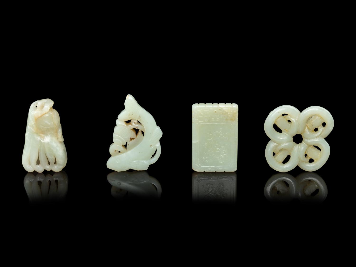 Four Chinese Pale Celadon Jade Pendants