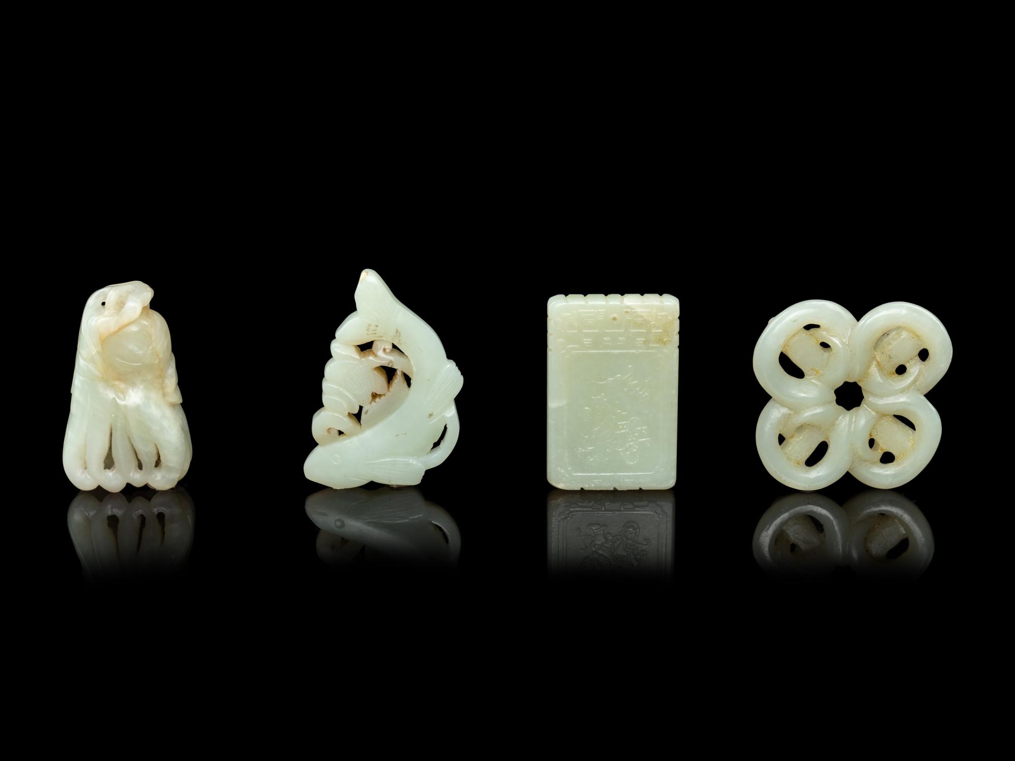 Four Chinese Pale Celadon Jade Pendants
