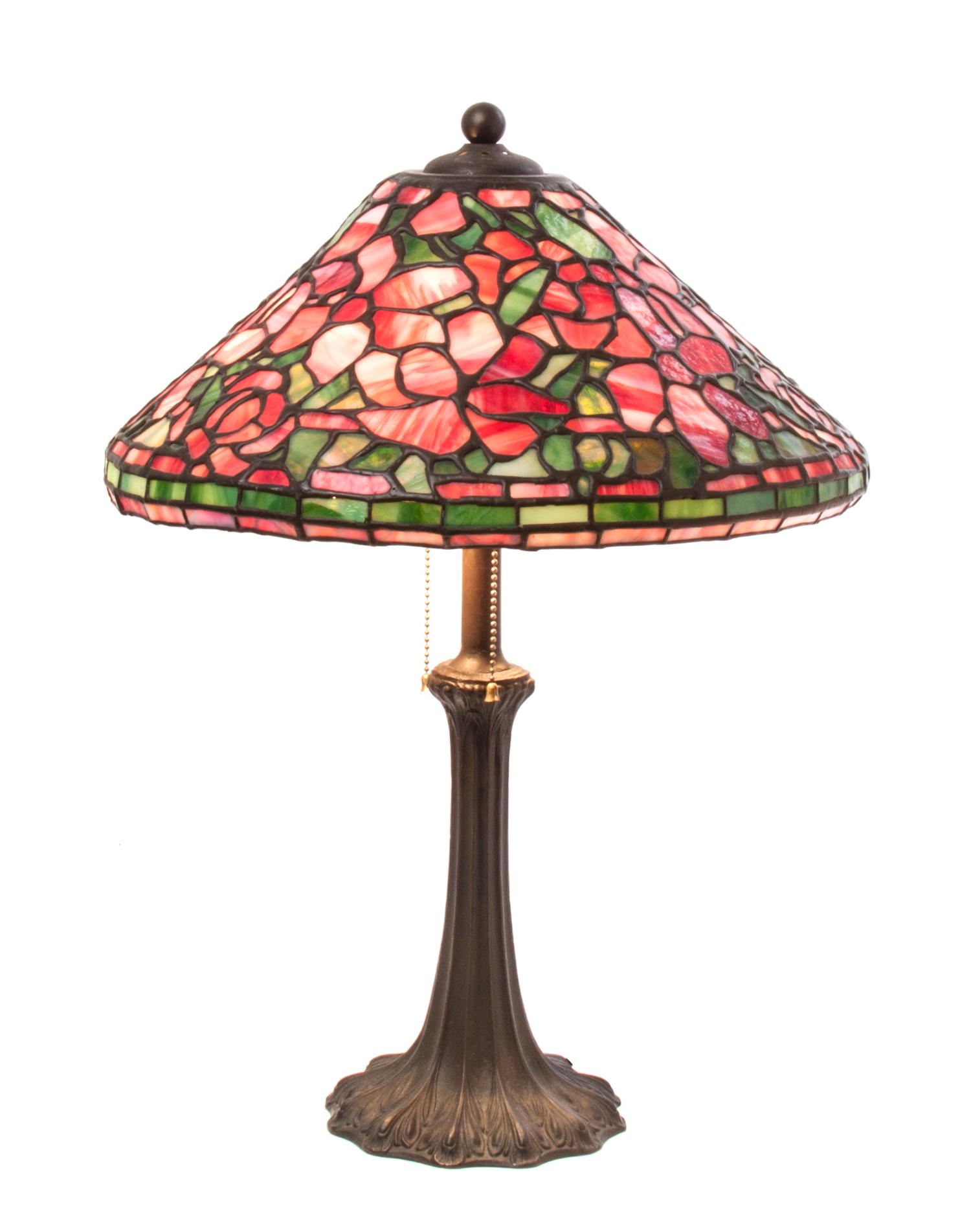 An American Leaded Glass Table Lamp, Height overall 22 1/2 inches x diameter of shade 16 1/2 inches.
